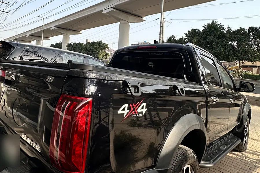 Black JAC T9 Hunter double-cab pickup for convoy rental in Lahore