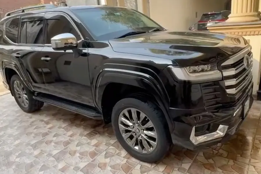 Black Toyota Land Cruiser parked in front of the Grand Rent A Car office, Near Islam Park Metro Train Station, G.T Road, Lahore